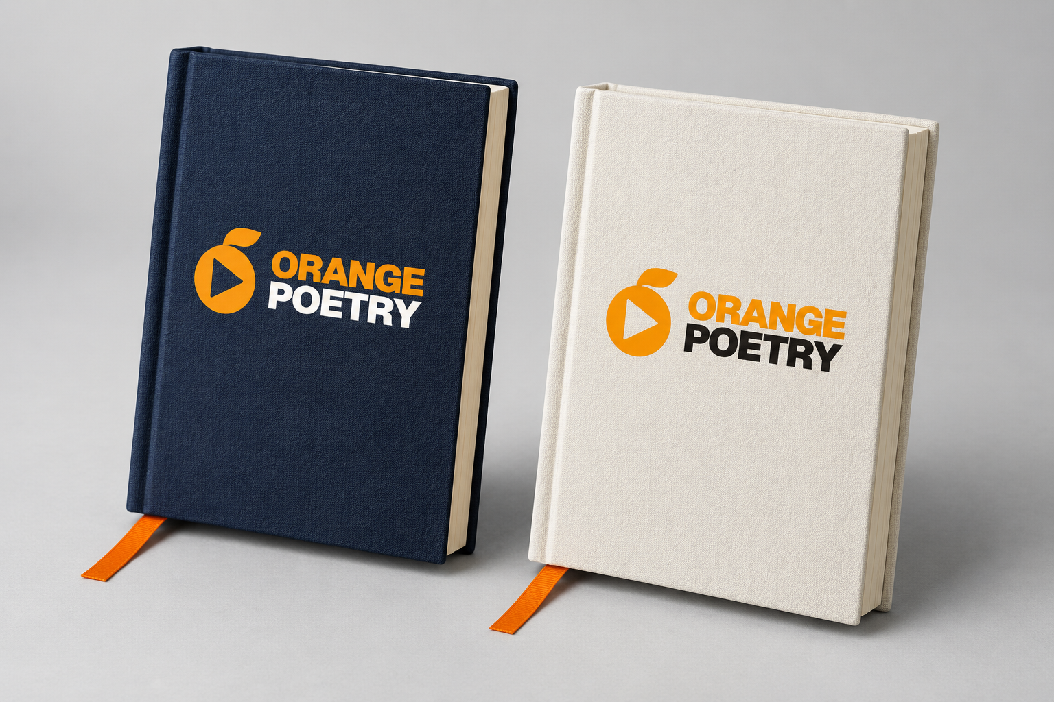 Midnight-navy and off-white Orange Poetry notebooks with orange ribbon bookmarks